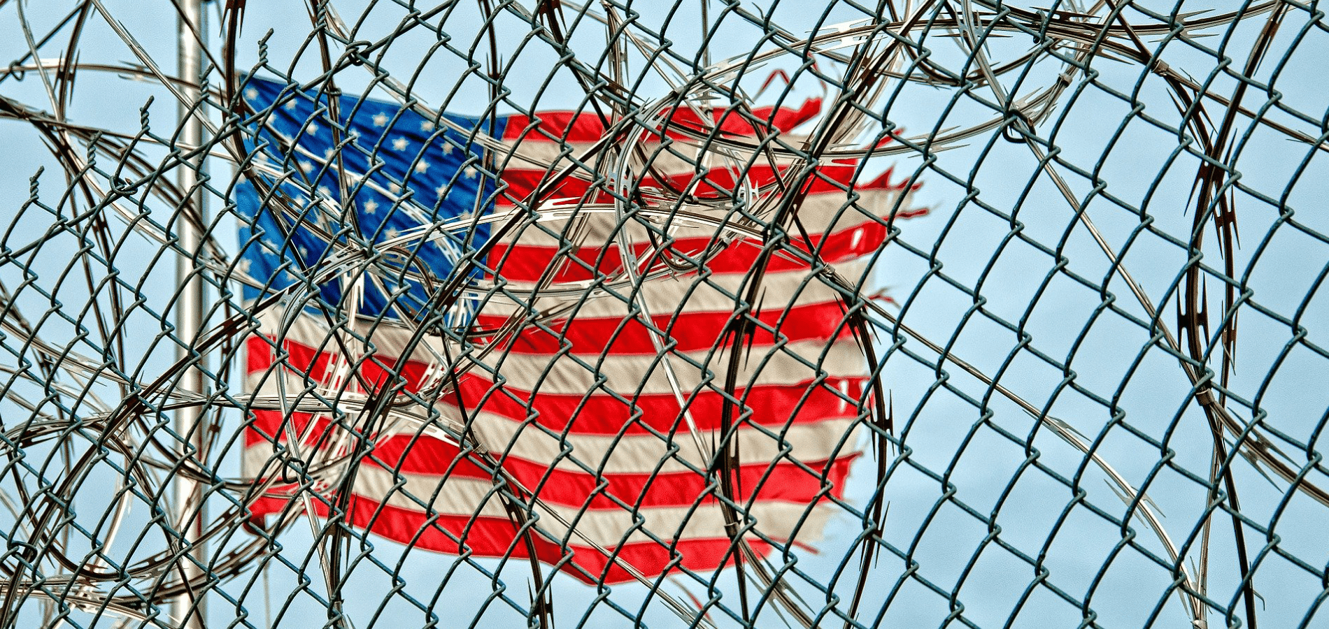 USA Flag behind a prison gate