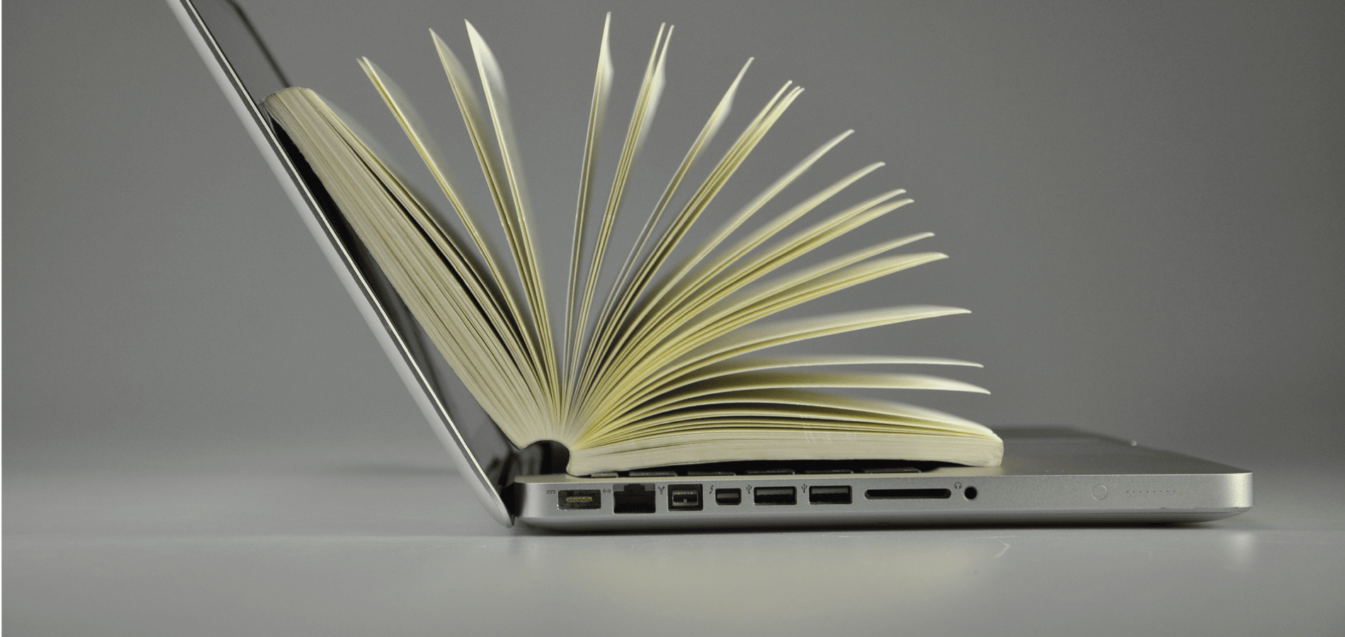 Book on top of a laptop