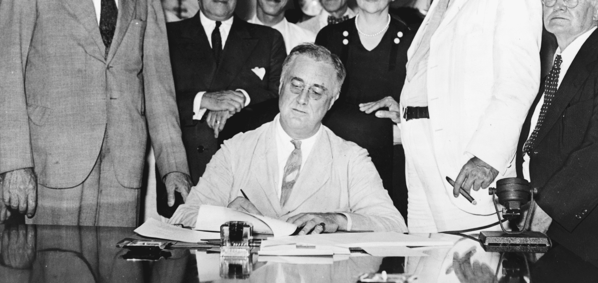 Roosevelt signing the Social Security Act