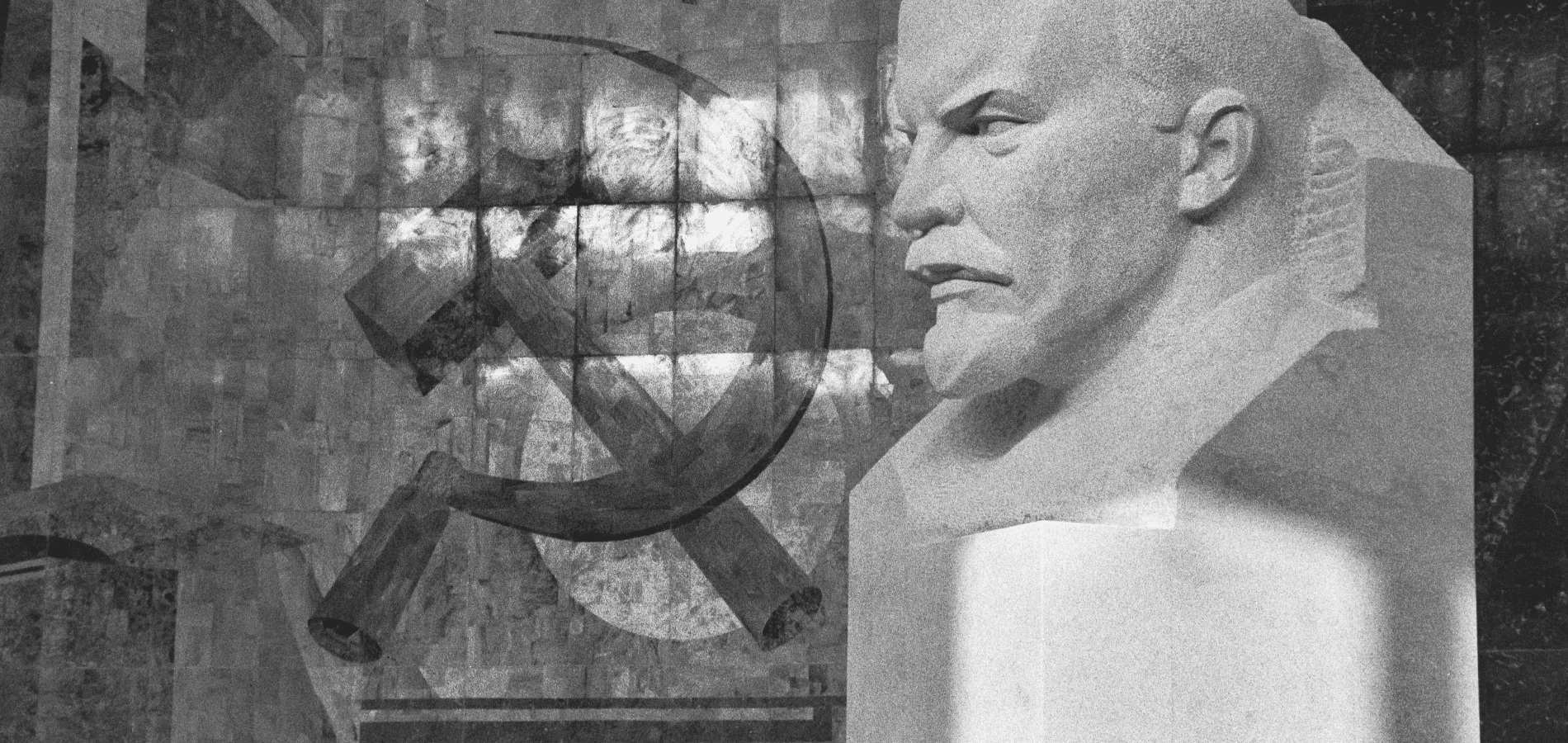 Russian Hammer and Sickle next to a bust of Lenin