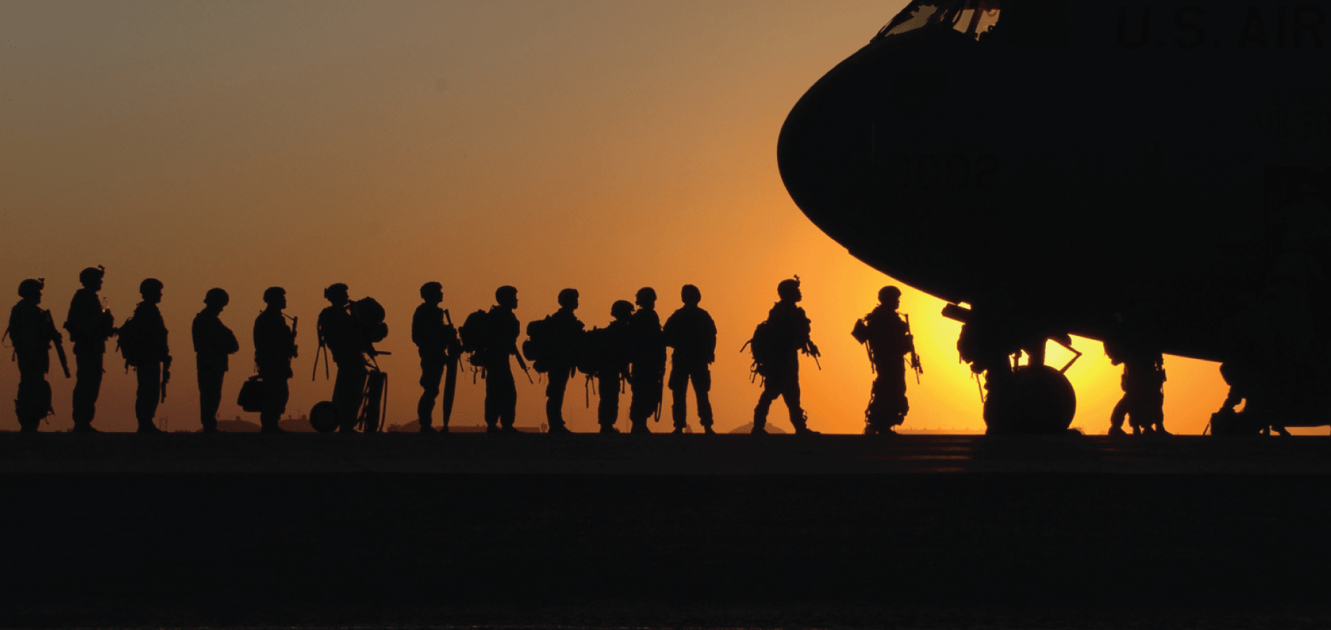 Soldiers boarding a military plane
