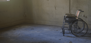 Empty wheelchair in empty room