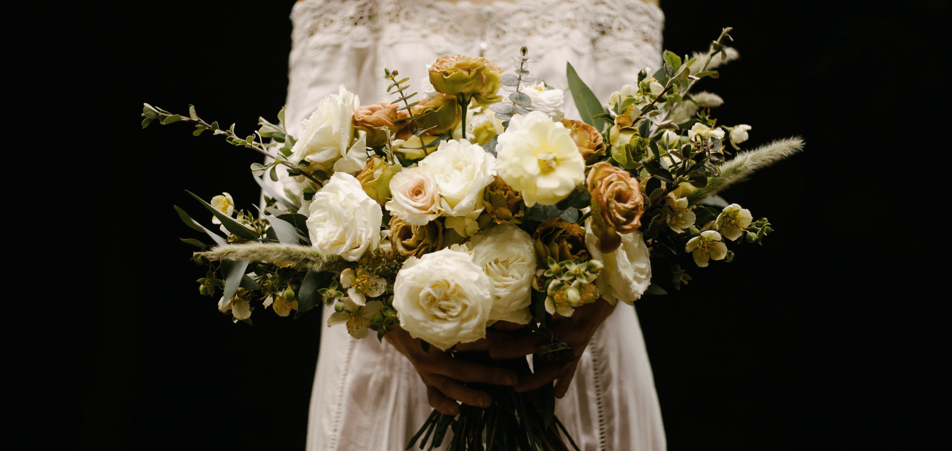 Woman in wedding dress with flower bouquet