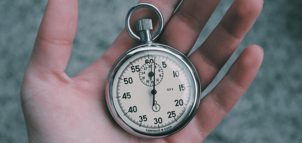 image of a hand holding a stopwatch