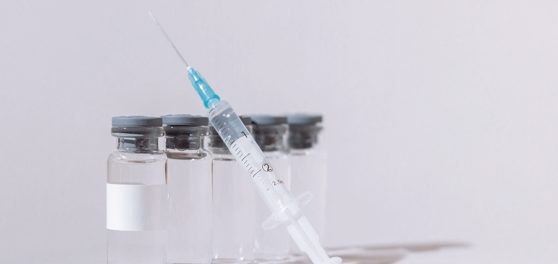 image of vaccine vials and needle