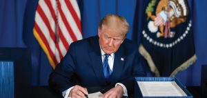 photo of Trump signing legislation