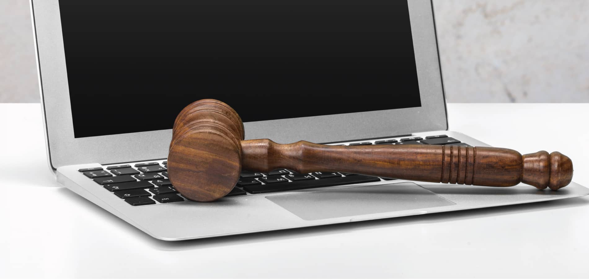 image of a gavel on a laptop