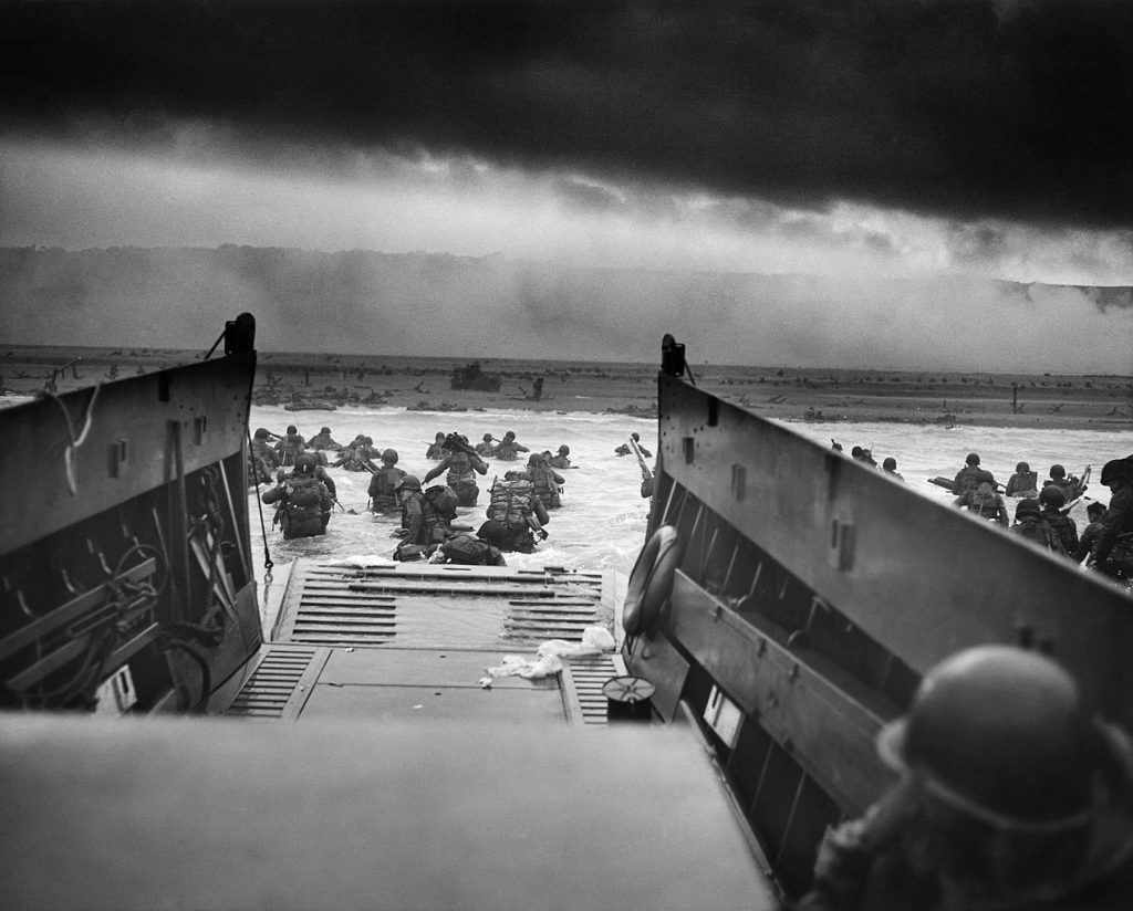 U.S. troops from Company A, 16th Infantry, 1st Infantry Division (the Big Red One) wade toward Omaha Beach on the morning of June 6, 1944.