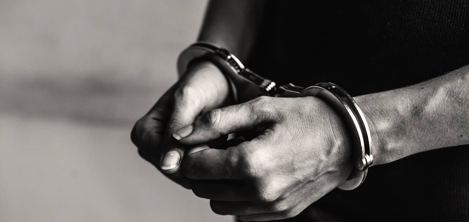 image of a person's hands in handcuffs