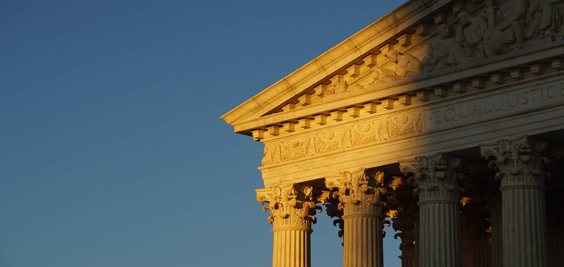 Close up image of the corner of the supreme court building