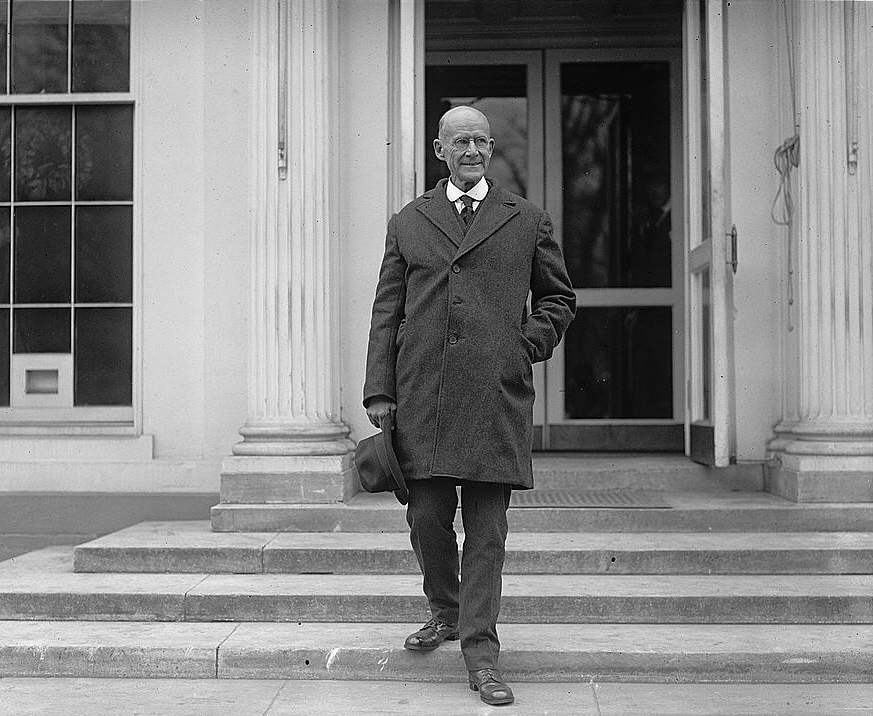 A photograph of Eugene Debs on the steps of the White House, following a visit with Warren G. Harding on the day after his release from prison. 
