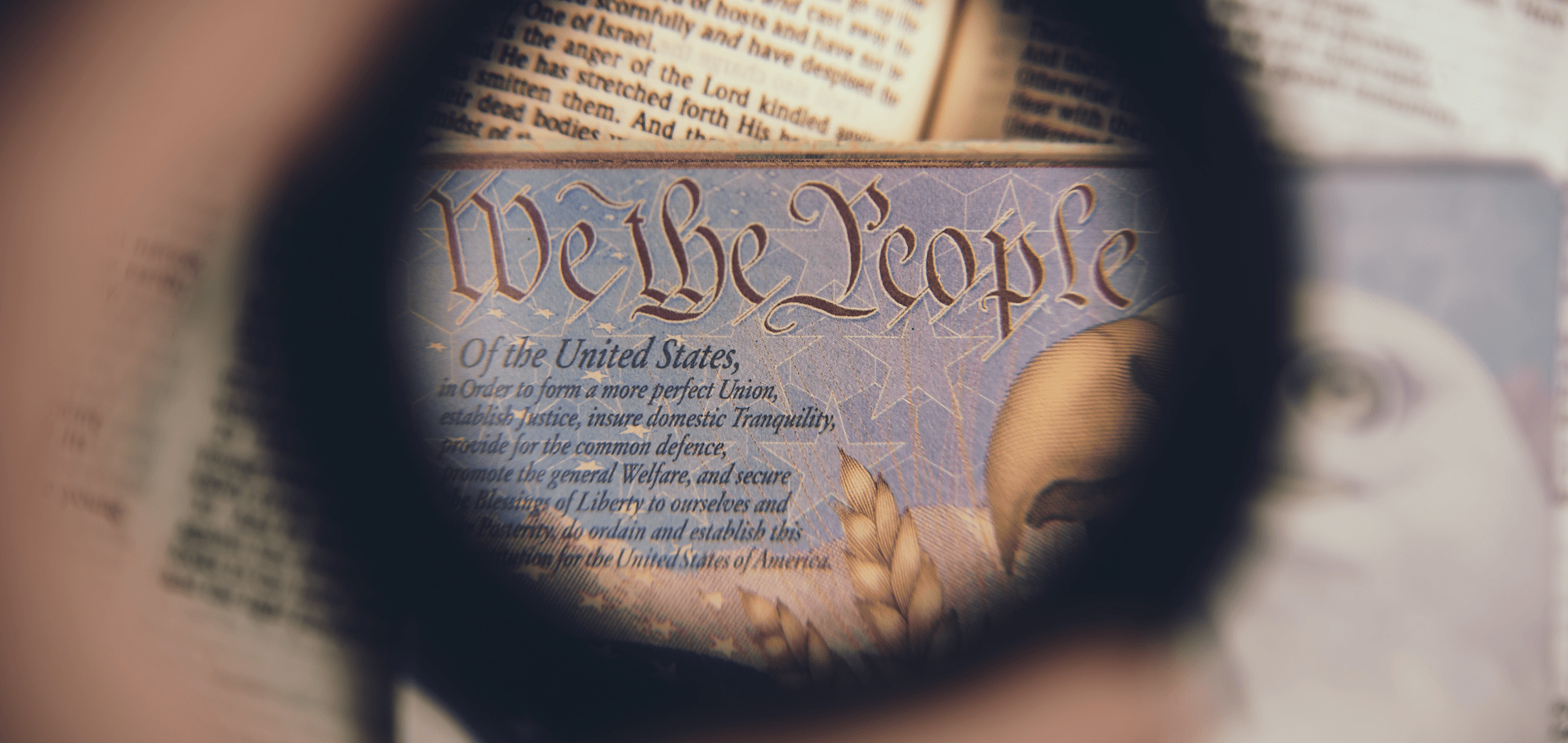 photo of the introduction of the Constitution through a magnifying glass