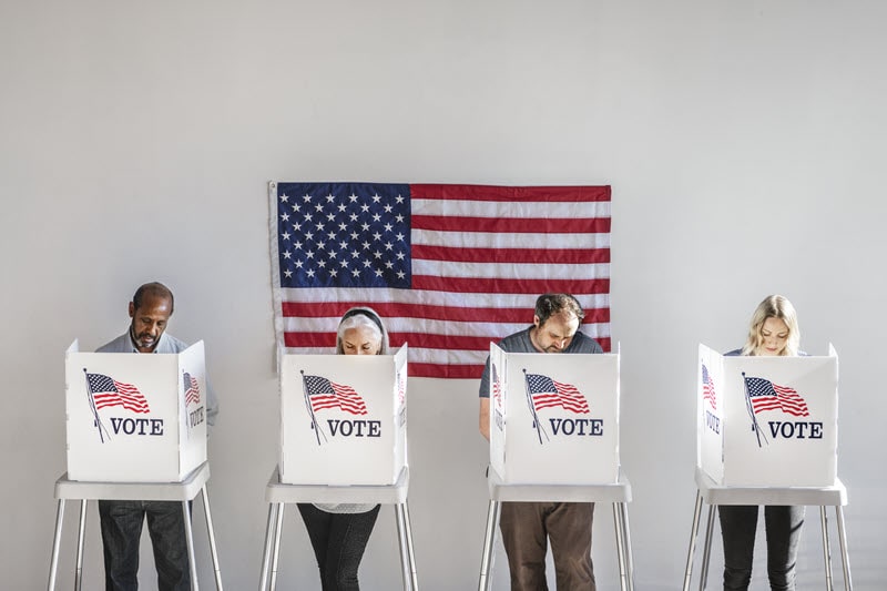 photo of four people voting