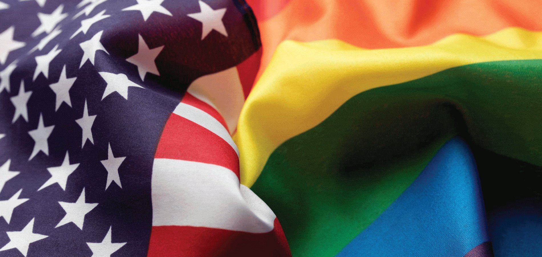 image of U.S. flag and rainbow flag next to each other