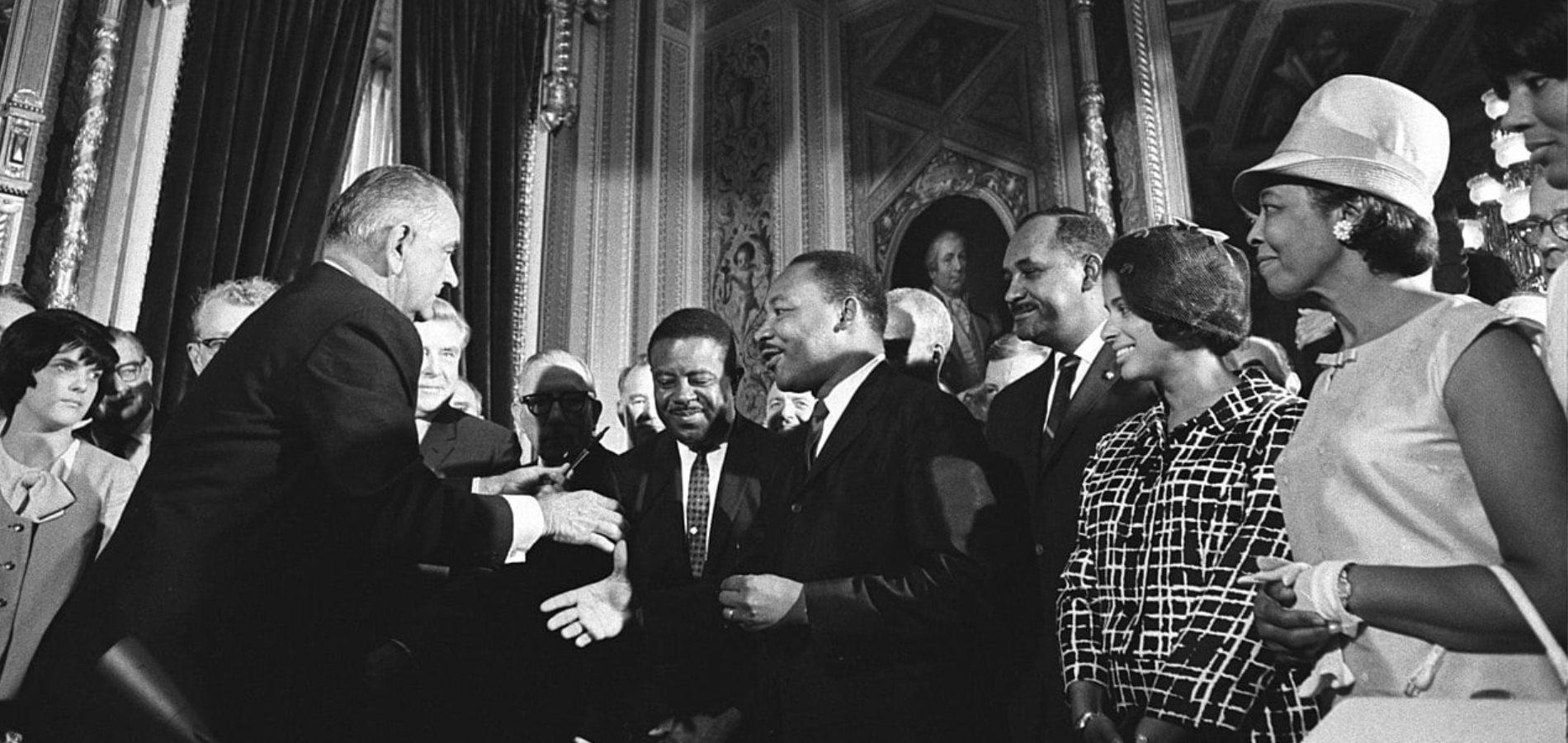 President Lyndon B. Johnson is joined by Civil Rights Leaders to sign the Voting Rights Act of 1965