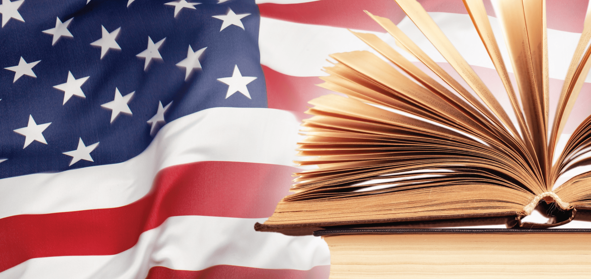 stack of books with American flag in the background