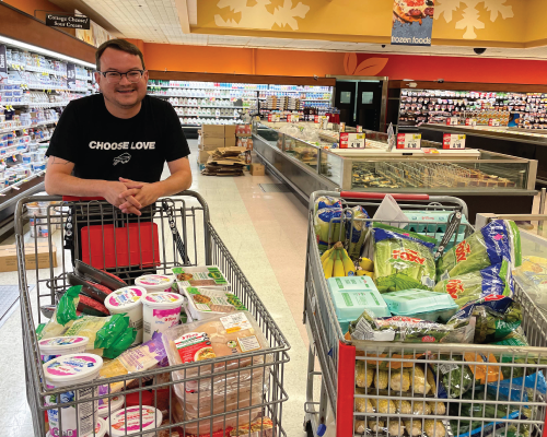 DE&I employee grocery shopping for local outreach