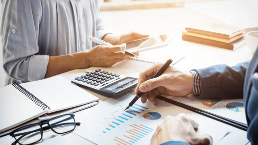 business people working on reports at a desk