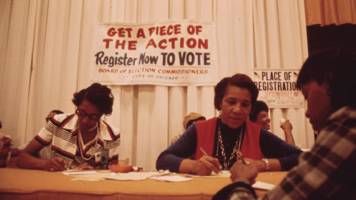 image of women registering people to vote
